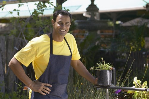 Gardener inspecting a garden near Hammersmith