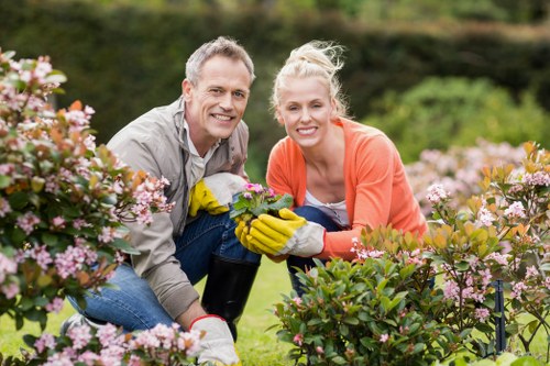 Worker demonstrating safe manual handling in a garden